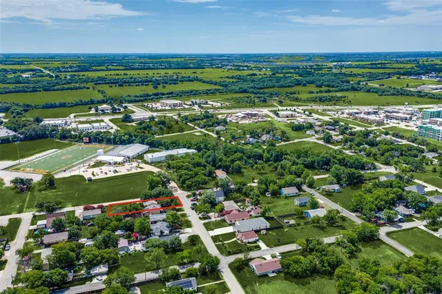an aerial view of a houses with outdoor space and street view