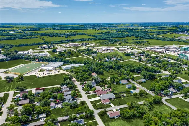 an aerial view of a golf course with parking space