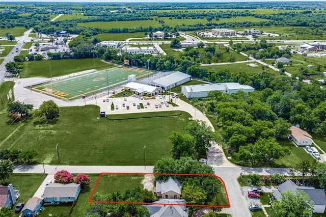 an aerial view of a houses with outdoor space and street view