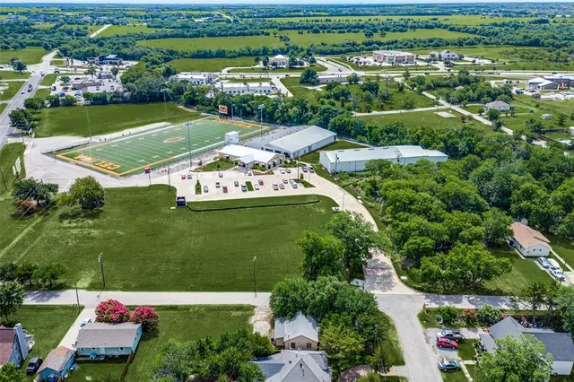 an aerial view of a houses with outdoor space and street view