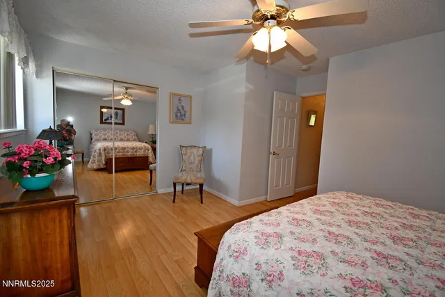 a bathroom with a sink mirror and toilet