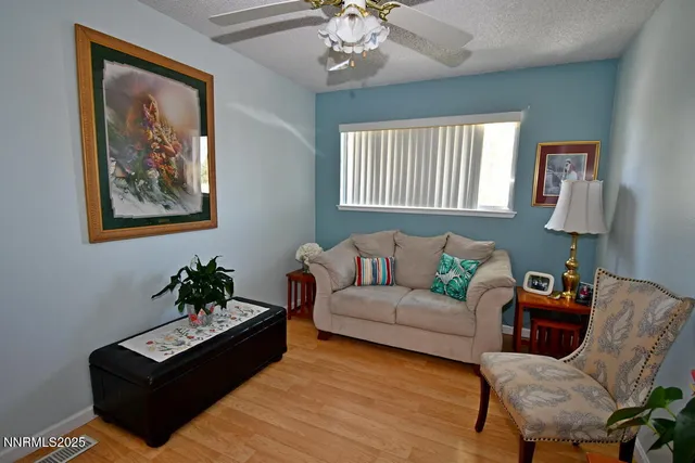 a view of a livingroom with furniture and wooden floor