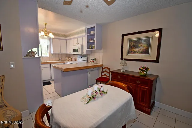a very nice looking dining room with a table and chairs