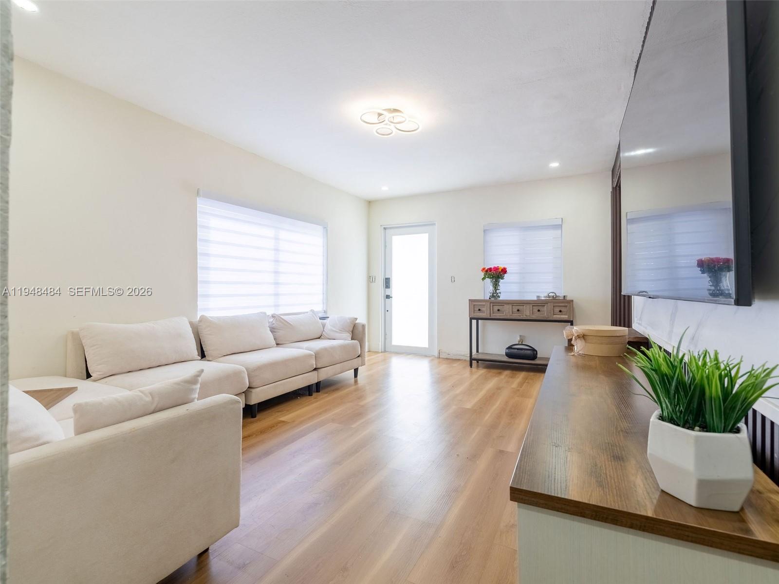 201 East 44th Street Hialeah, FL 33013 - Photo 11 of 39 a living room with furniture and a potted plant