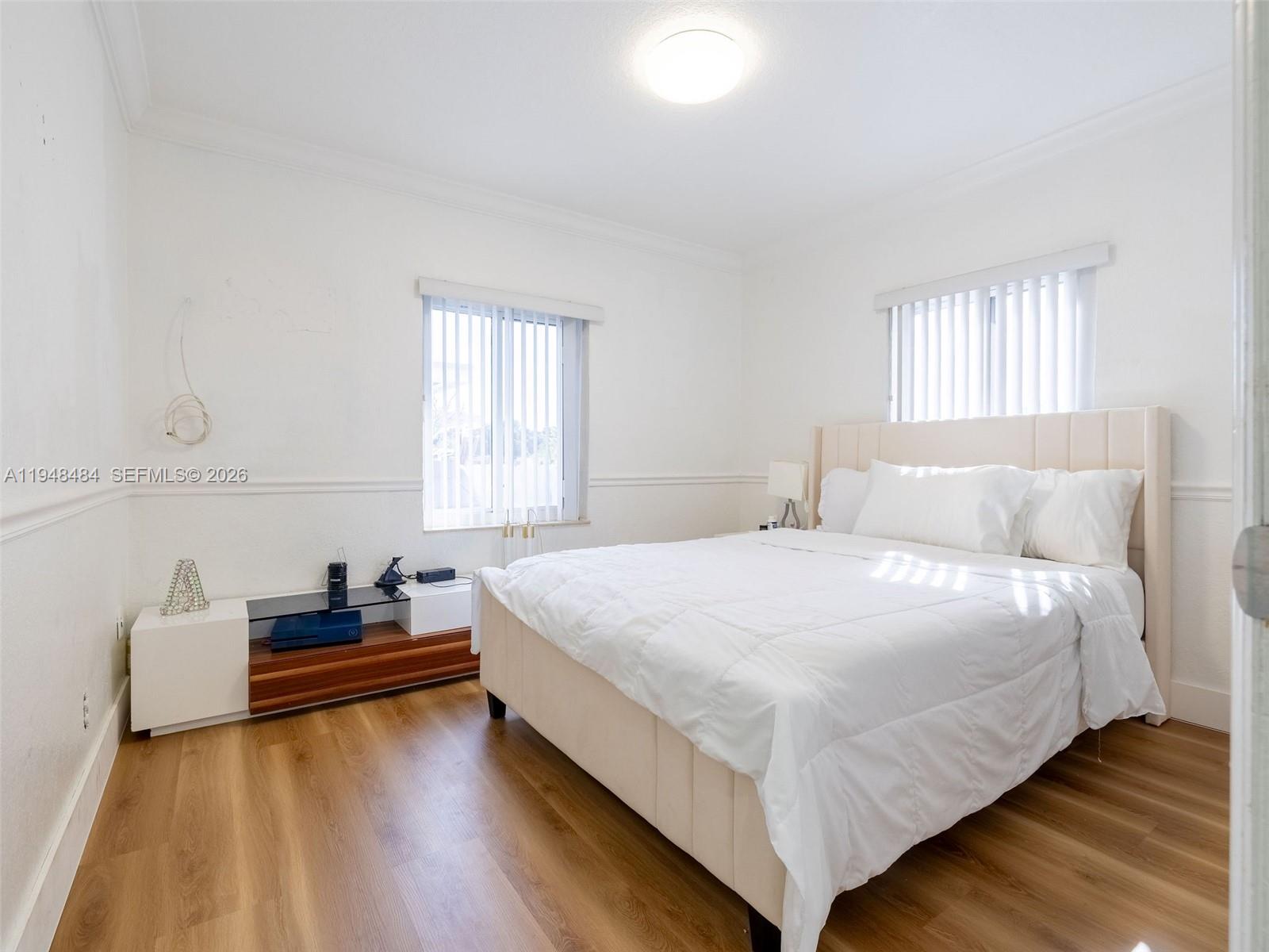 201 East 44th Street Hialeah, FL 33013 - Photo 13 of 39 a bedroom with a bed and a window