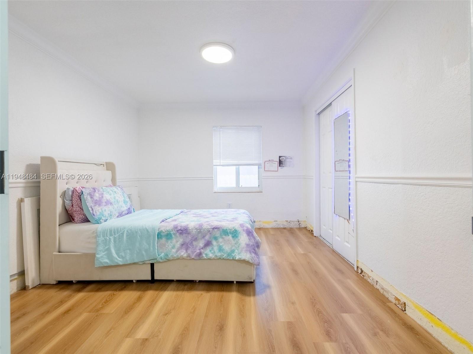 201 East 44th Street Hialeah, FL 33013 - Photo 18 of 39 a bedroom with a bed and a window