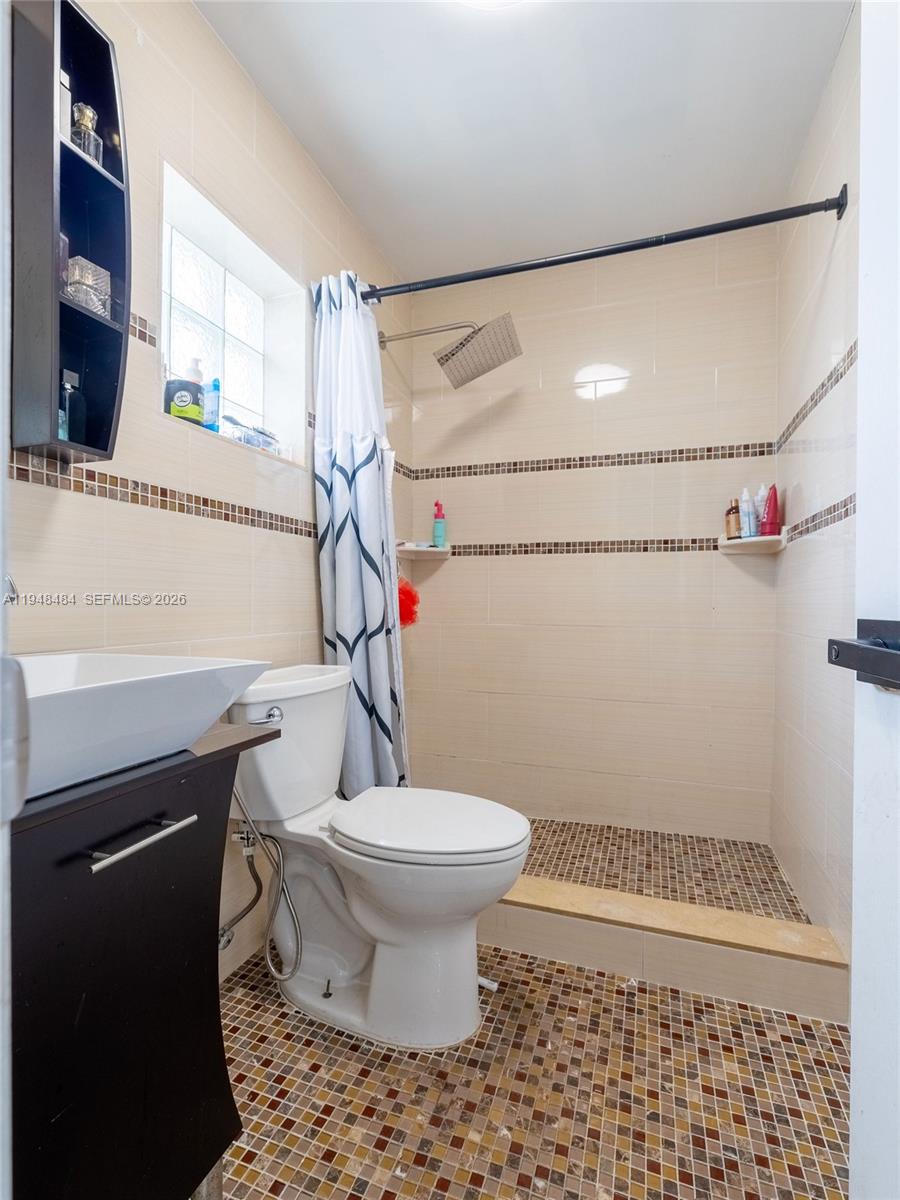 201 East 44th Street Hialeah, FL 33013 - Photo 21 of 39 a bathroom with a sink toilet and shower
