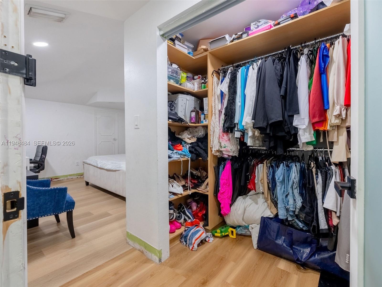 201 East 44th Street Hialeah, FL 33013 - Photo 22 of 39 a view of walk in closet with clothes and shoes