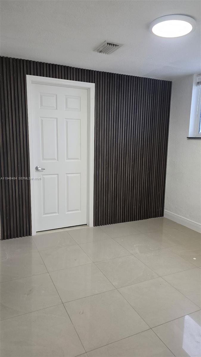 201 East 44th Street Hialeah, FL 33013 - Photo 32 of 41 an empty room with wooden floor
