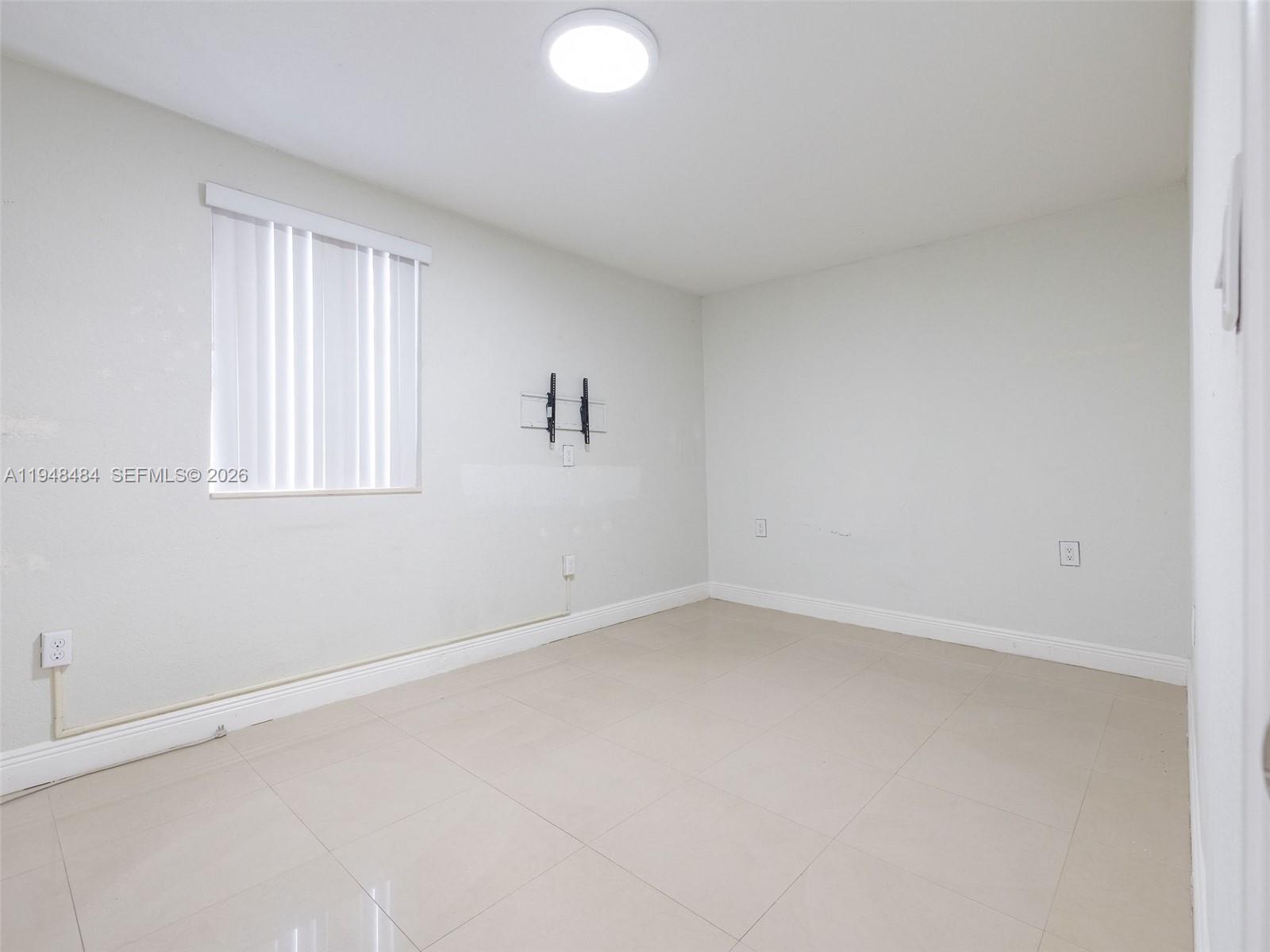 201 East 44th Street Hialeah, FL 33013 - Photo 35 of 41 an empty room with a window