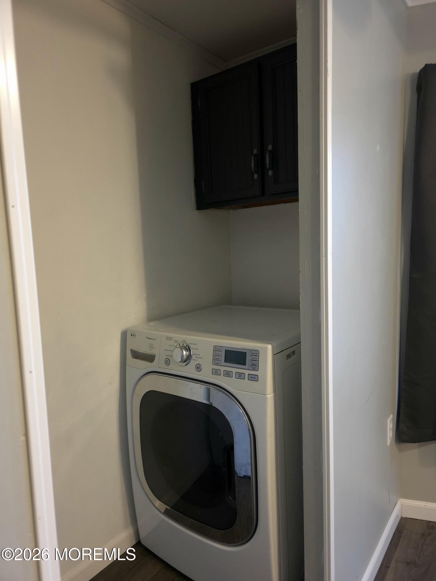 80 Secretariat Street, Unit 66 Howell, NJ 07731 - Photo 11 of 25 a utility room with dryer and washer