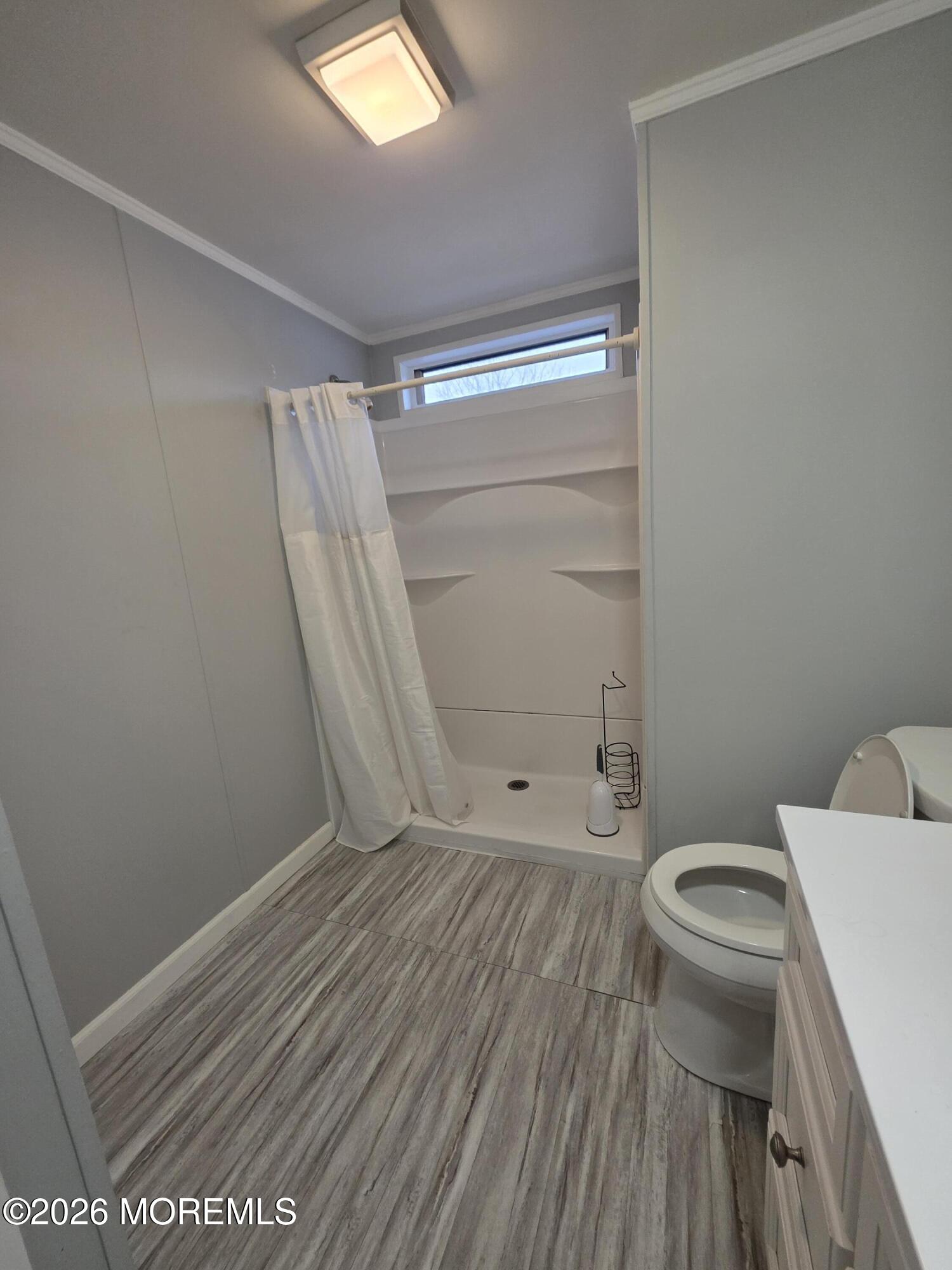 80 Secretariat Street, Unit 66 Howell, NJ 07731 - Photo 16 of 25 a bathroom with a toilet and a shower