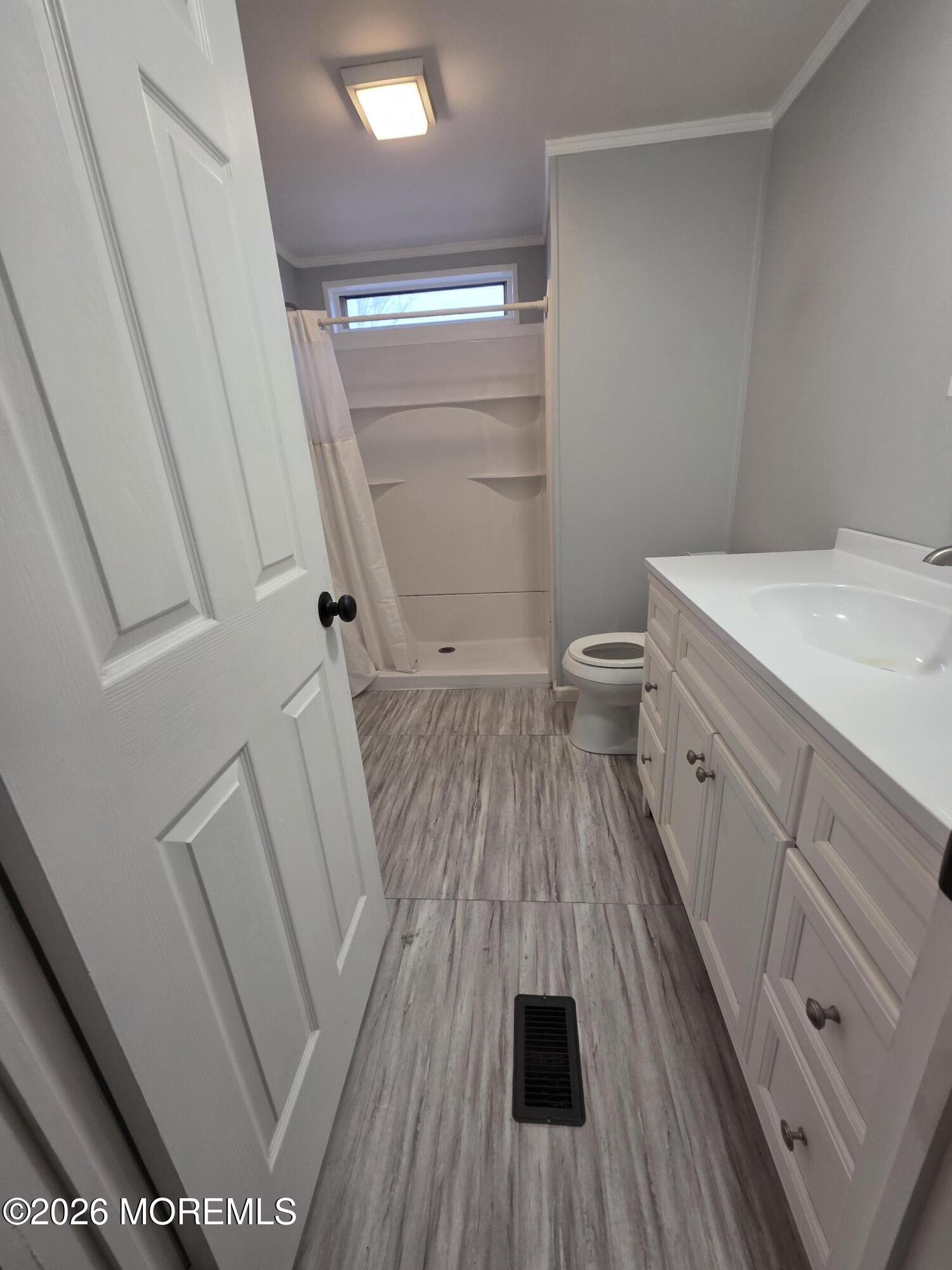 80 Secretariat Street, Unit 66 Howell, NJ 07731 - Photo 17 of 25 a view of a bathroom with a sink and a toilet