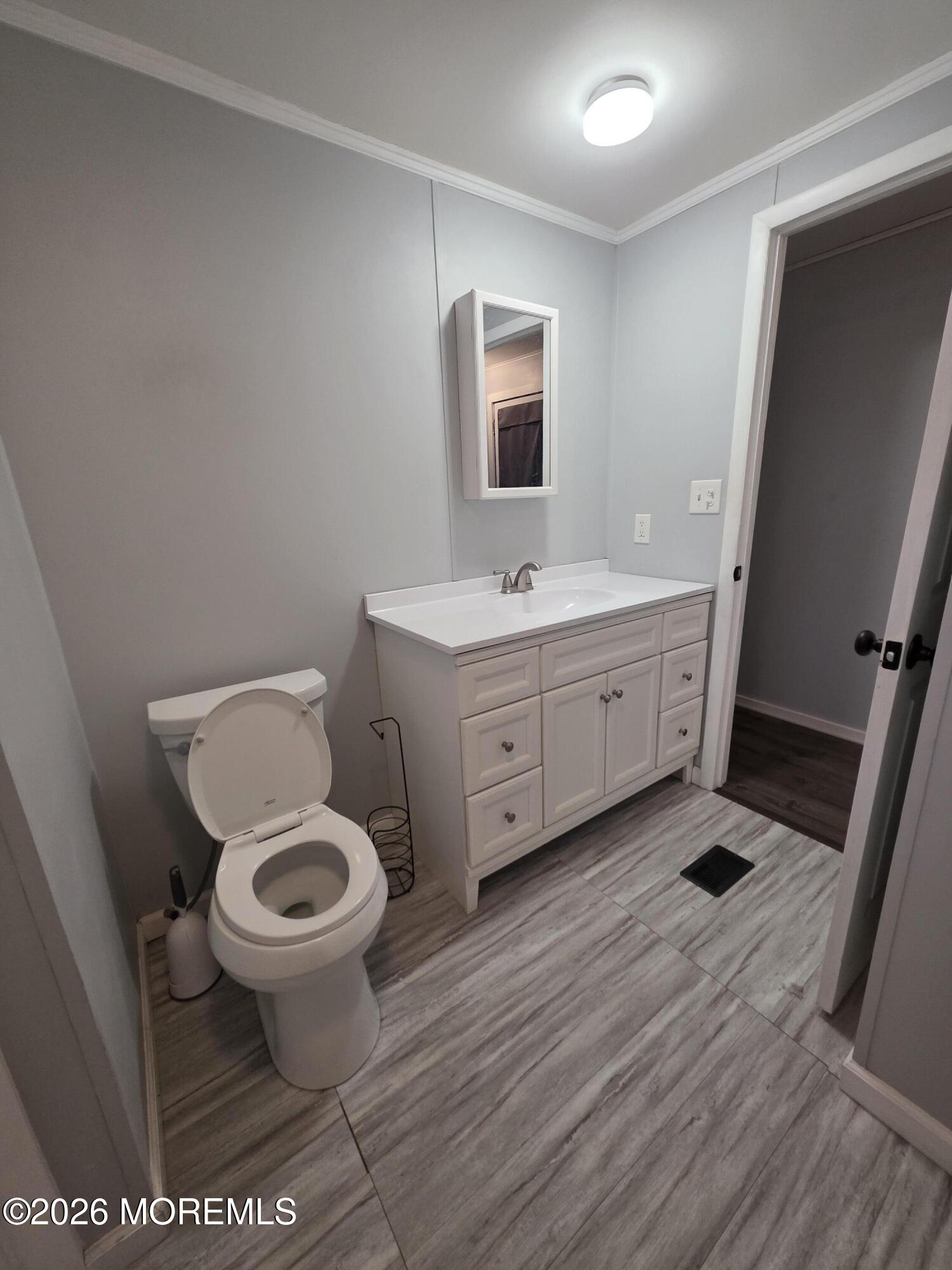 80 Secretariat Street, Unit 66 Howell, NJ 07731 - Photo 20 of 25 a bathroom with a sink and a toilet
