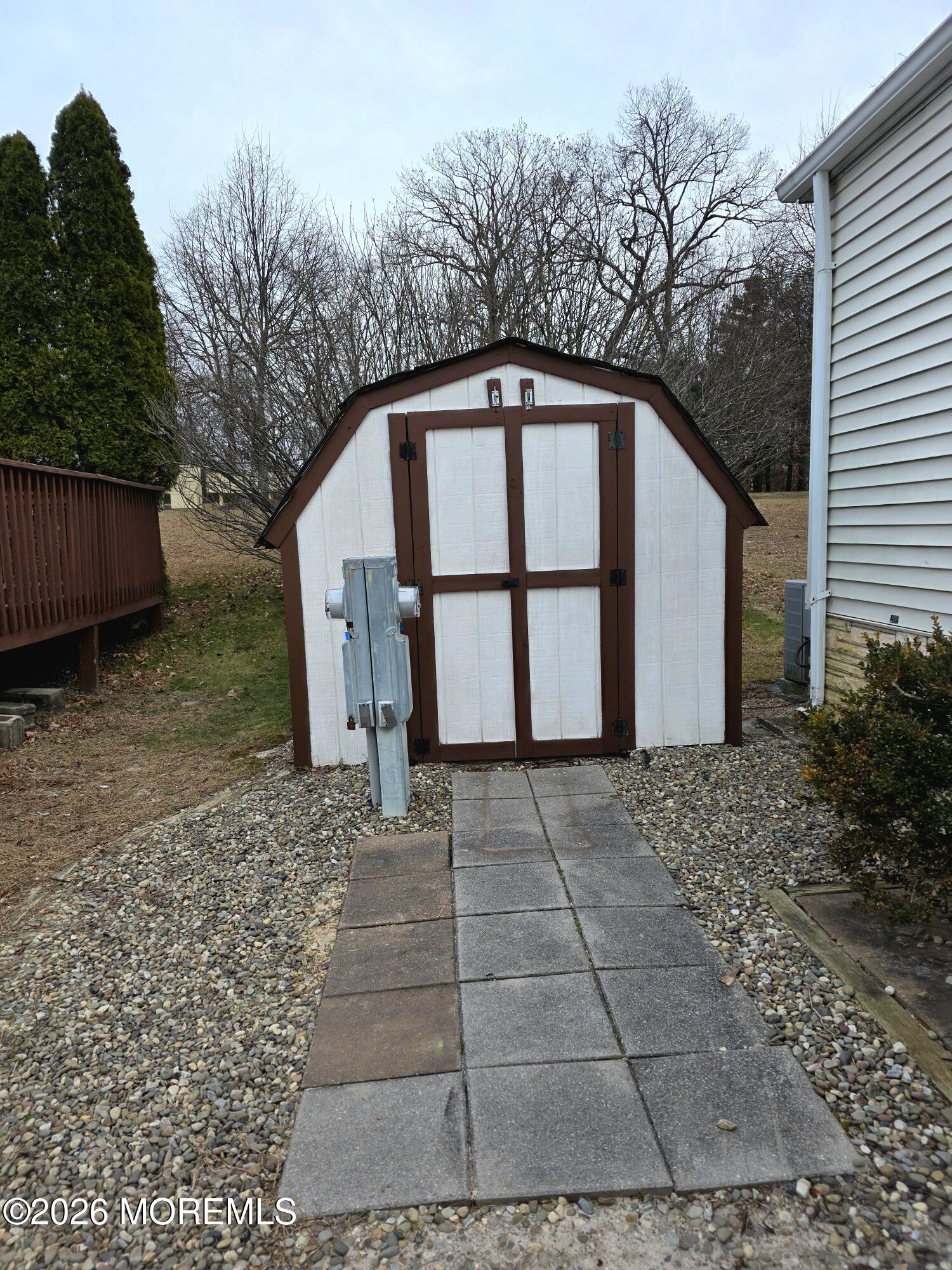 80 Secretariat Street, Unit 66 Howell, NJ 07731 - Photo 25 of 25 a view of backyard with large trees and wooden fence