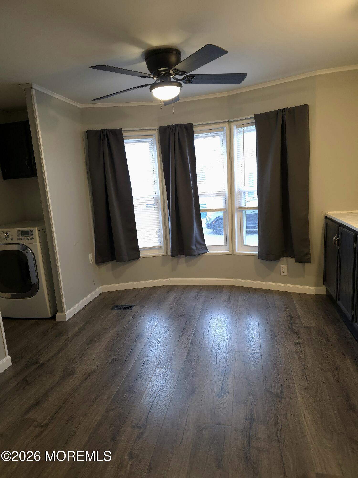 80 Secretariat Street, Unit 66 Howell, NJ 07731 - Photo 4 of 25 a view of a livingroom with wooden floor and a window