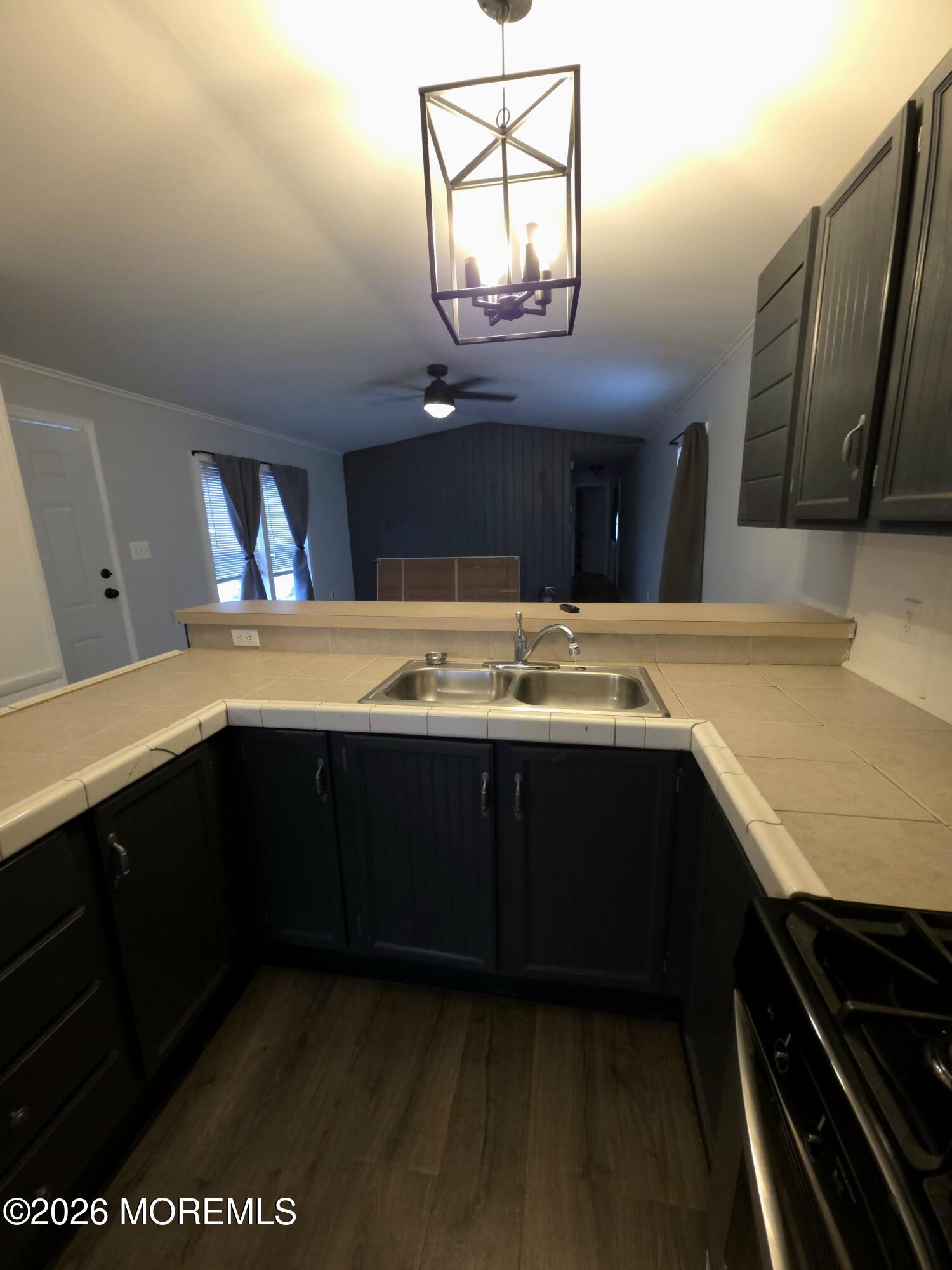 80 Secretariat Street, Unit 66 Howell, NJ 07731 - Photo 7 of 25 a kitchen with a sink and cabinets