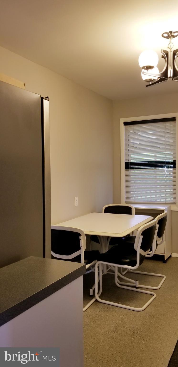 3907 Sybil Road Randallstown, MD 21133 - Photo 15 of 30 a room with table chairs and window