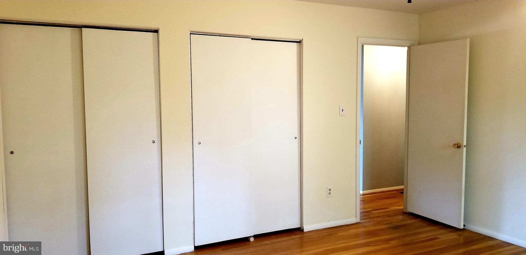 3907 Sybil Road Randallstown, MD 21133 - Photo 18 of 30 a view of walk in closet with wooden floor