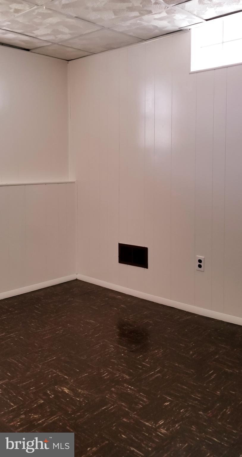 3907 Sybil Road Randallstown, MD 21133 - Photo 23 of 30 a view of an empty room with wooden floor