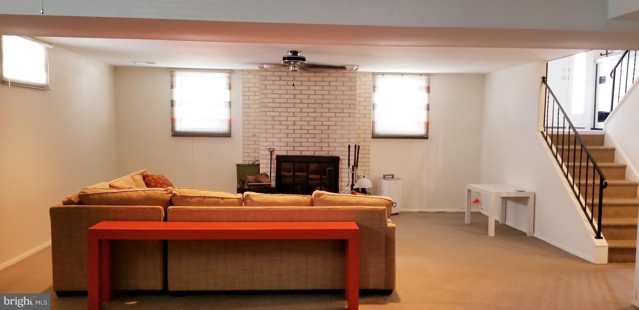 3907 Sybil Road Randallstown, MD 21133 - Photo 25 of 30 a bedroom with a bed and a fireplace