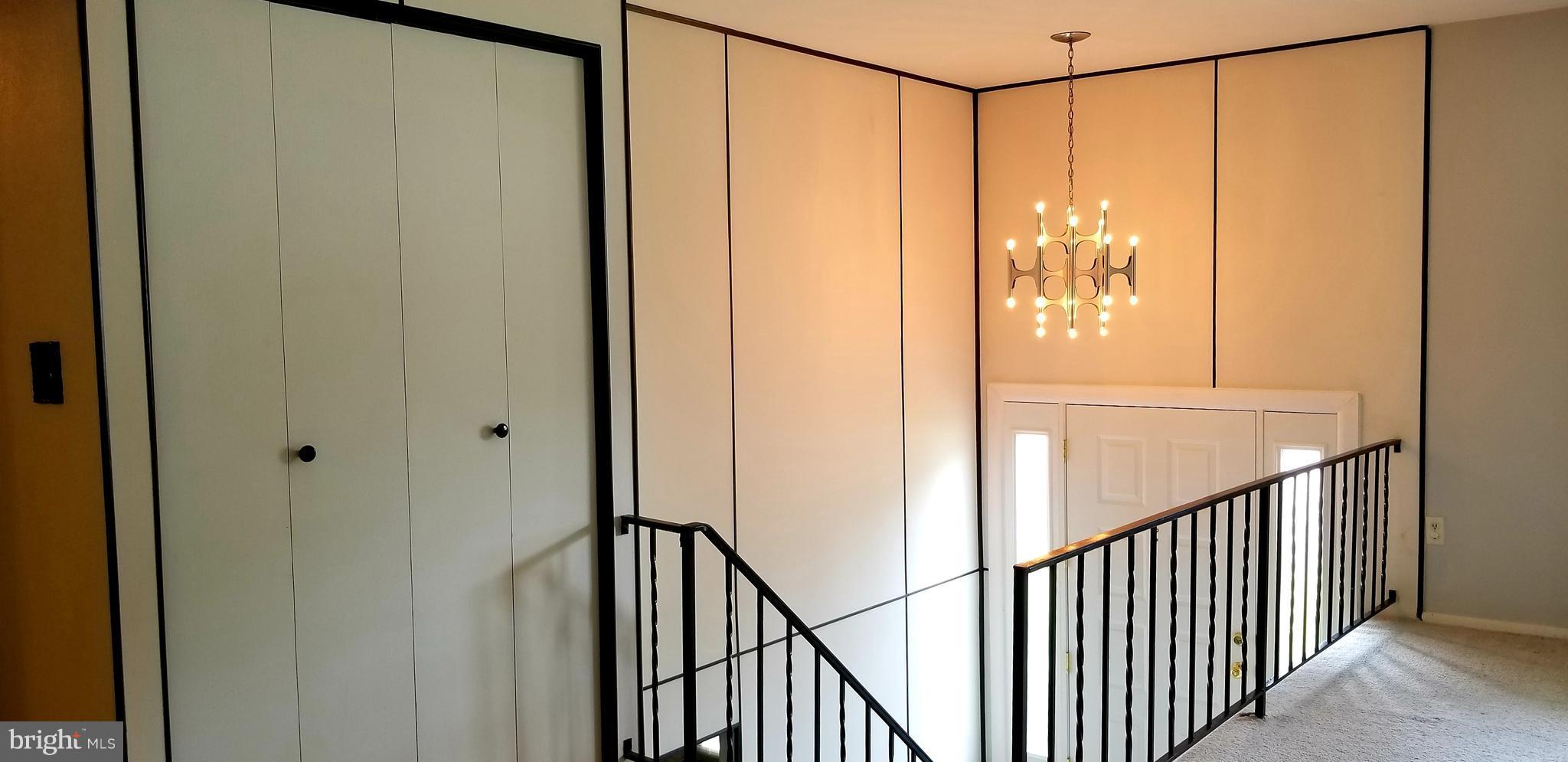 3907 Sybil Road Randallstown, MD 21133 - Photo 8 of 30 a view of a hallway with wooden floor and entryway