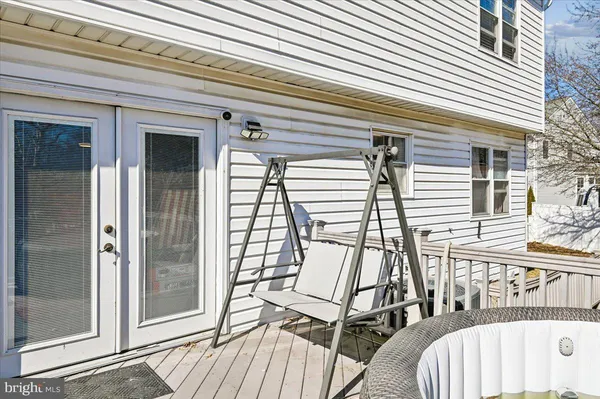 a view of a patio with a table and chairs
