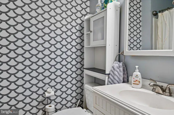 a bedroom with a bed and a book shelf