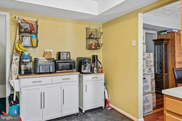a kitchen with stainless steel appliances a refrigerator and a stove top oven