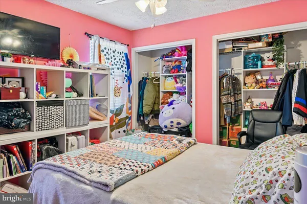 a bedroom with a bed and closet