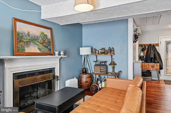 a bedroom with furniture and a fireplace