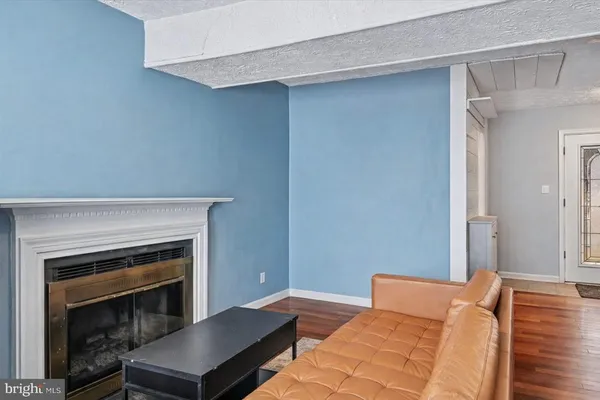 a bedroom with a bed and a fireplace