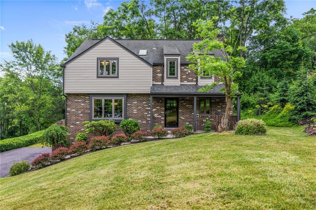 front view of a house with a yard