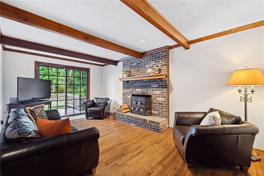 2972 East Hardies Road Gibsonia, PA 15044 - Photo 15 of 42 a living room with furniture and a fireplace