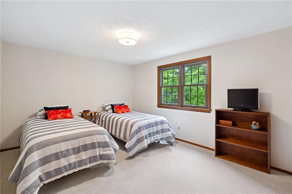 2972 East Hardies Road Gibsonia, PA 15044 - Photo 17 of 42 a bedroom with two beds and a flat screen tv