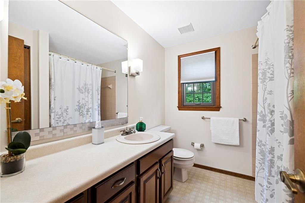 2972 East Hardies Road Gibsonia, PA 15044 - Photo 20 of 42 a bathroom with a sink a toilet and a large mirror