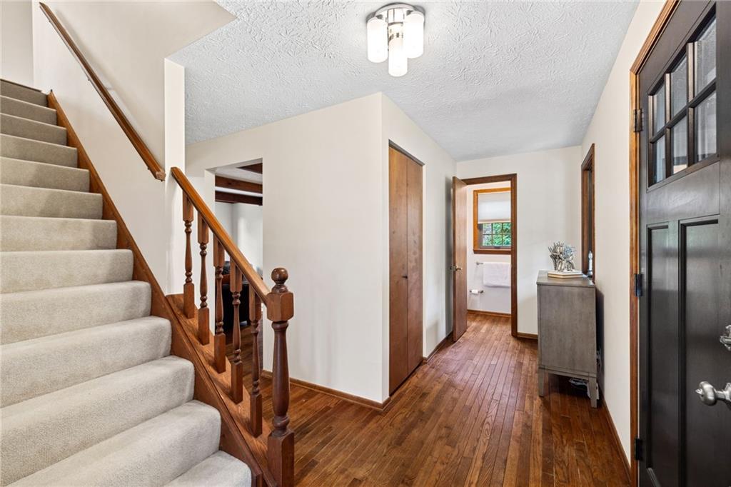 2972 East Hardies Road Gibsonia, PA 15044 - Photo 5 of 42 a view of a hallway with wooden floor and staircase
