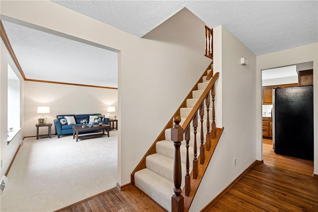 2972 East Hardies Road Gibsonia, PA 15044 - Photo 7 of 42 a view of a livingroom with furniture stairs and a couch