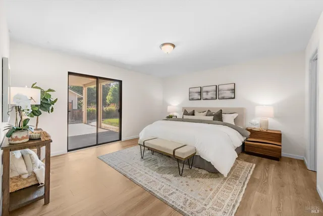 a bedroom with furniture and a rug