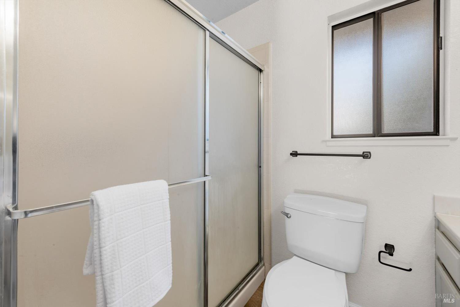 107 Inyo Court Vacaville, CA 95687 - Photo 24 of 49 a white toilet sitting next to a bathroom sink