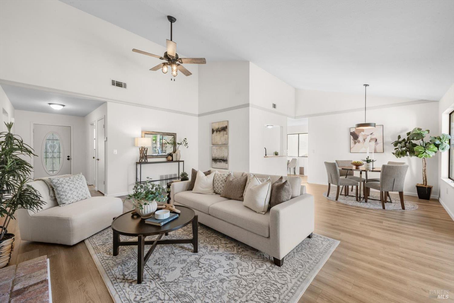 107 Inyo Court Vacaville, CA 95687 - Photo 4 of 49 a living room with furniture kitchen view and a chandelier