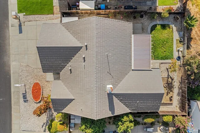 an aerial view of residential house with outdoor space and seating area