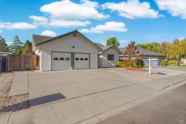 a view of house with outdoor space and sitting area