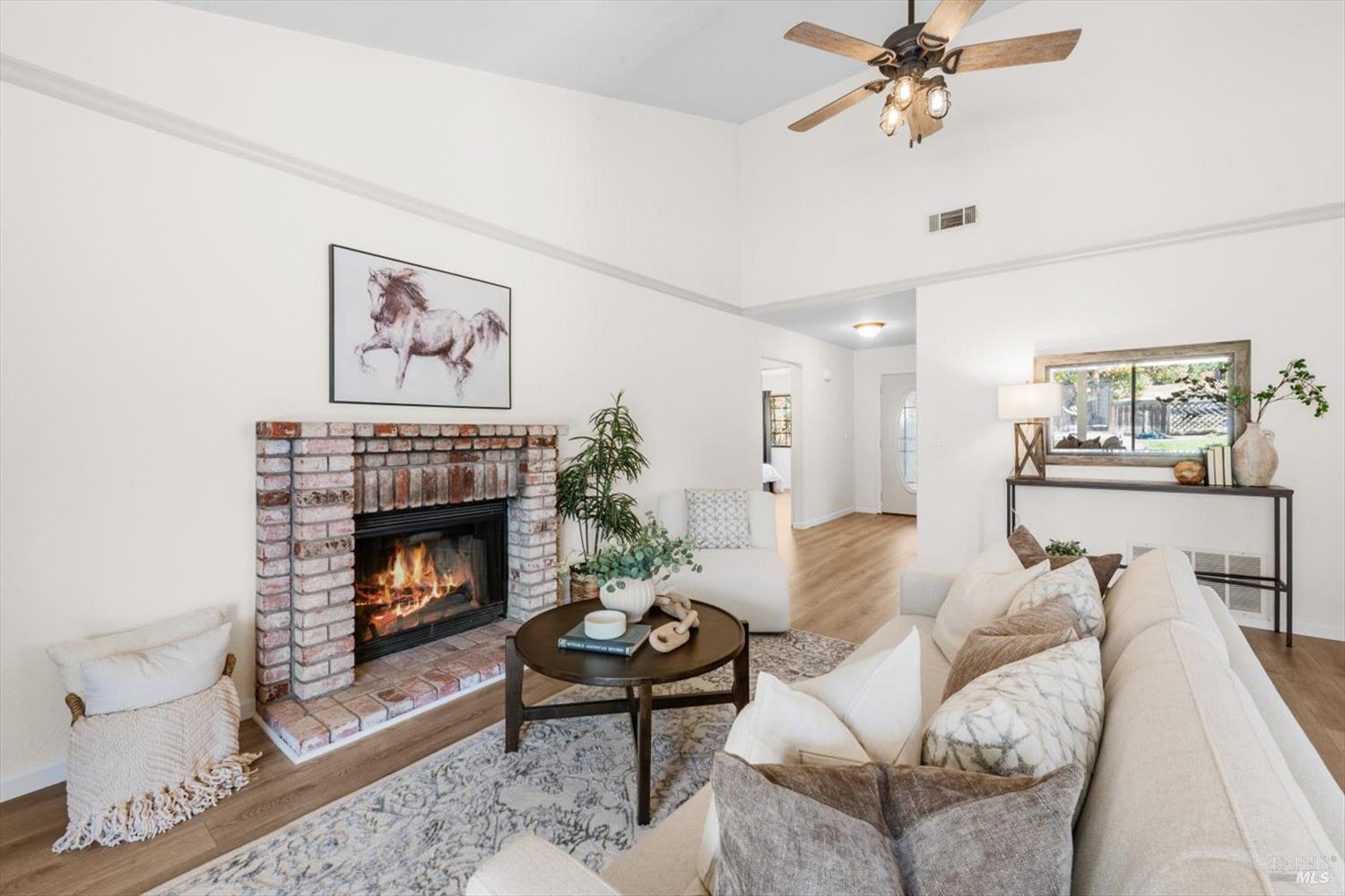 107 Inyo Court Vacaville, CA 95687 - Photo 5 of 49 a living room with furniture and a fireplace