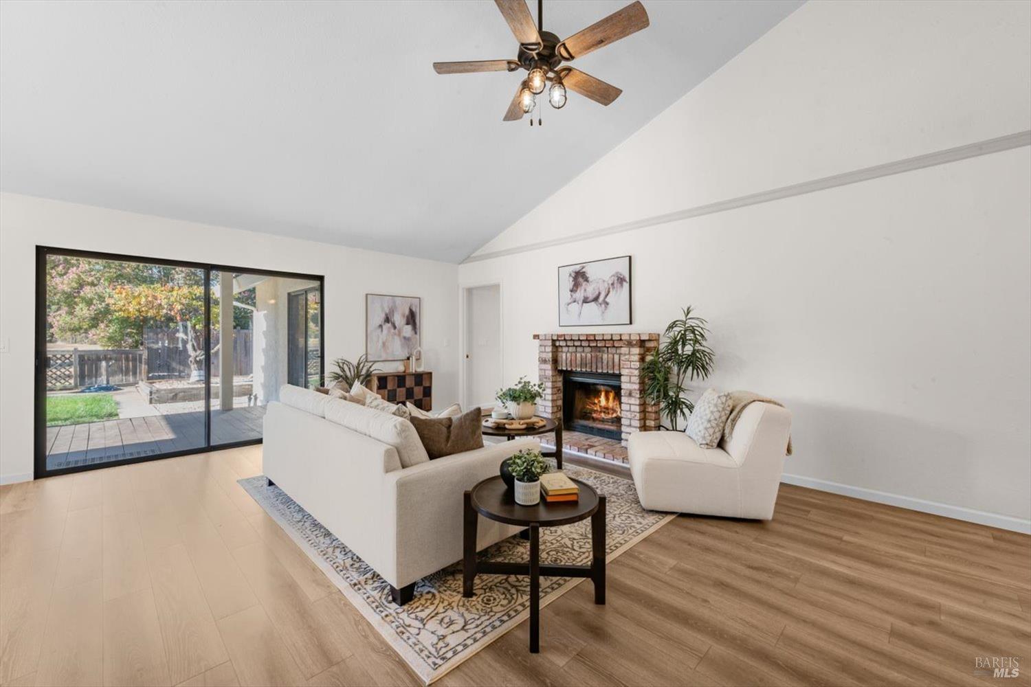 107 Inyo Court Vacaville, CA 95687 - Photo 7 of 49 a living room with furniture large window and a fireplace