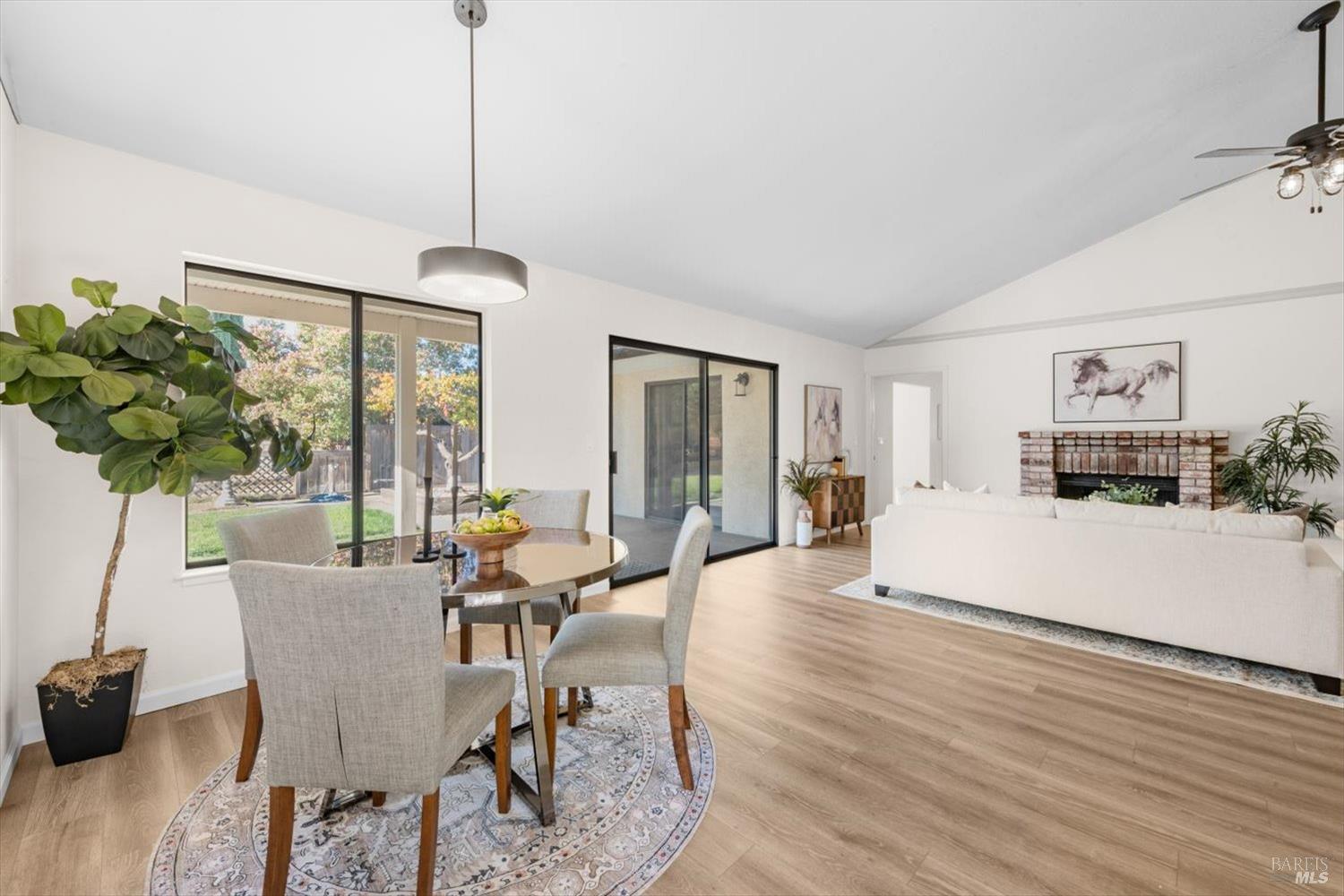 107 Inyo Court Vacaville, CA 95687 - Photo 9 of 49 a view of a dining room with furniture window and wooden floor