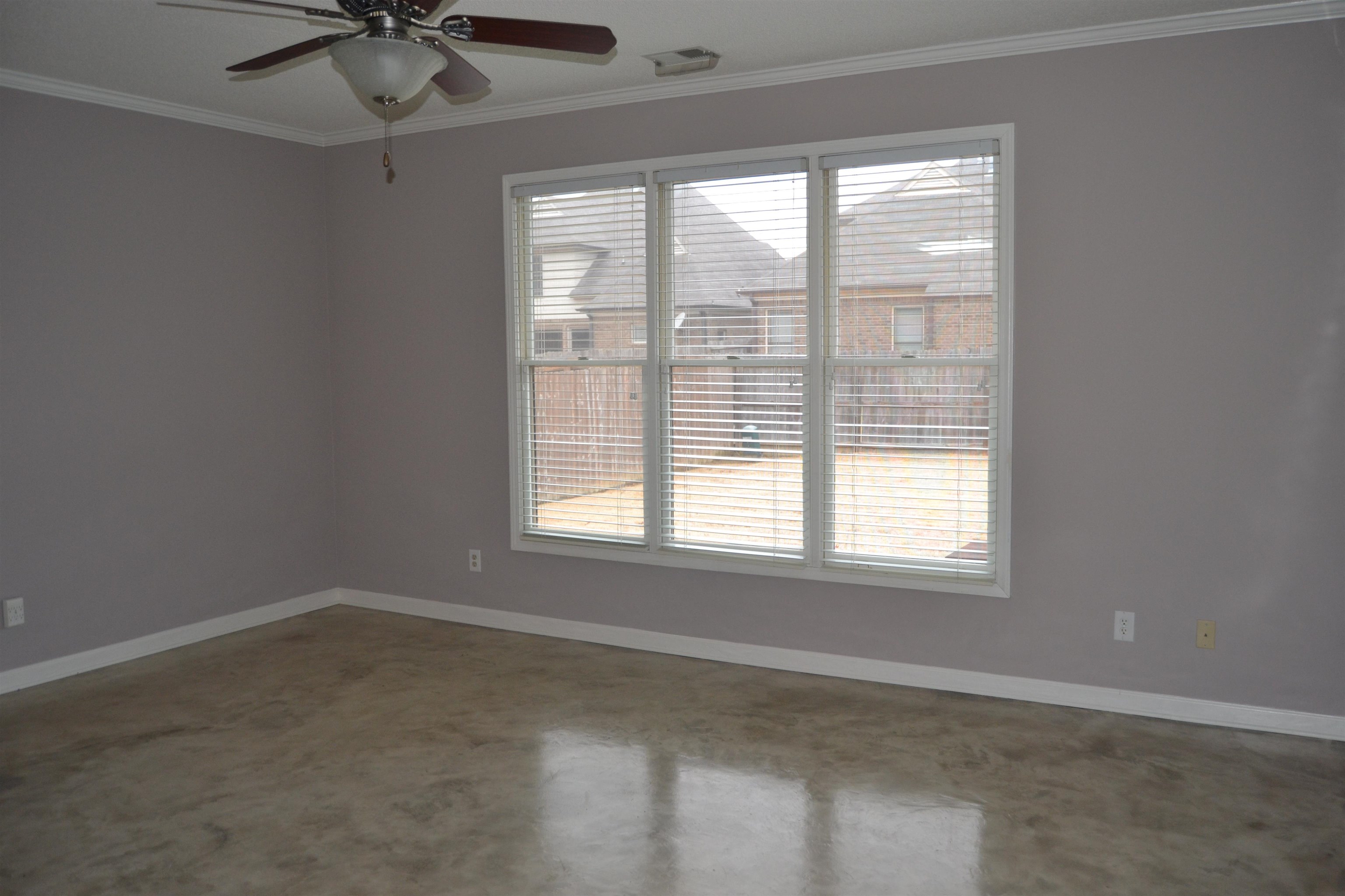 10486 Juneau Way Collierville, TN 38017 - Photo 12 of 33 Empty room with plenty of natural light, ceiling fan, and ornamental molding