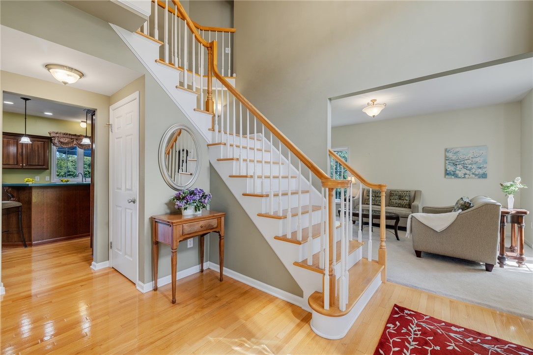 1782 Sweets Corners Road Penfield, NY 14450 - Photo 6 of 49 Gleaming hardwood floors and a soaring ceiling welcome visitors into this graceful entryway.
