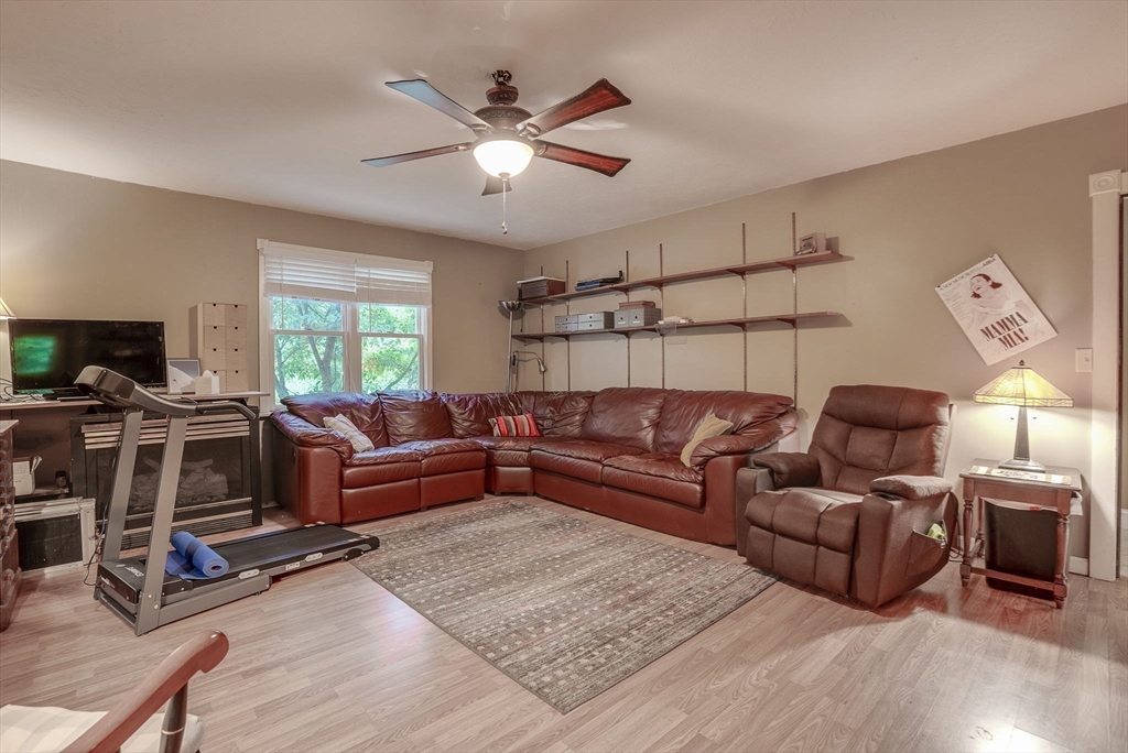 49 S Road Templeton, MA 01468 - Photo 15 of 33 a living room with furniture ceiling fan and a wooden floor