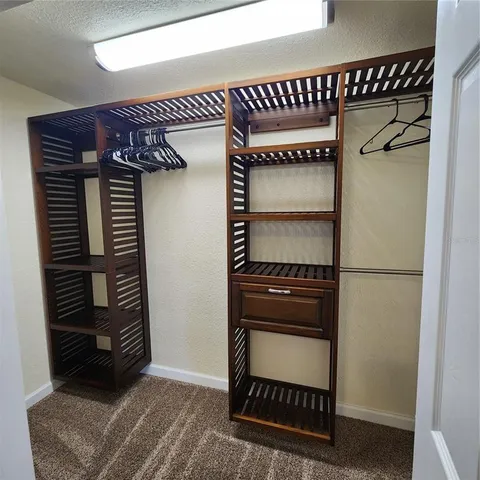a kitchen with a refrigerator and a stove